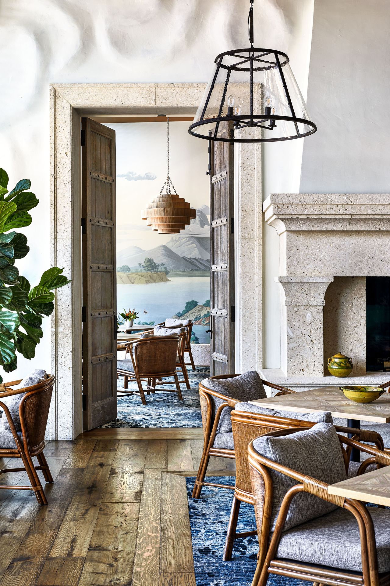 Stone dining hall with mountain and lake mural