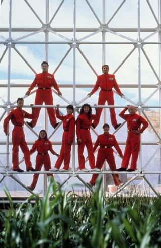 Biospherians (left to right): Bernd Zabel, Taber MacMullen (top) Mark Van Thillo, Jane Poynter, Linda Leigh, Roy Walford (middle), Abigail Alling, and SallySilverstone (bottom) posing inside Biosphere 2 in 1990.