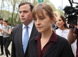 ctress Allison Mack (R) departs the United States Eastern District Court after a bail hearing in relation to the sex trafficking charges filed against her on May 4, 2018 in the Brooklyn borough of New York City. 