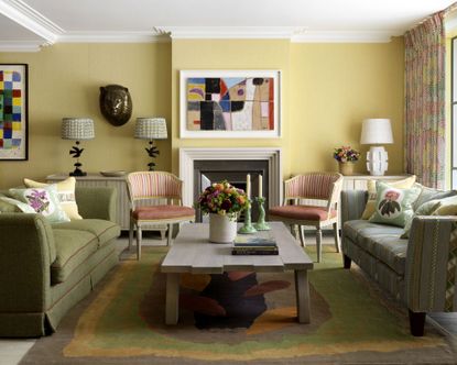 lighting a living room with green sofas