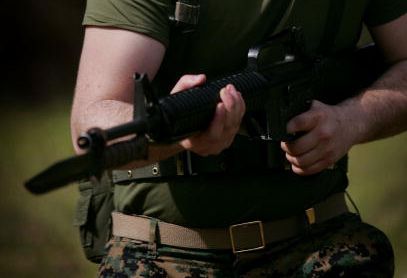 A Marine holds a bayonet