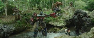 a giant red-and-blue robot faces off against a gorilla-shaped robot
