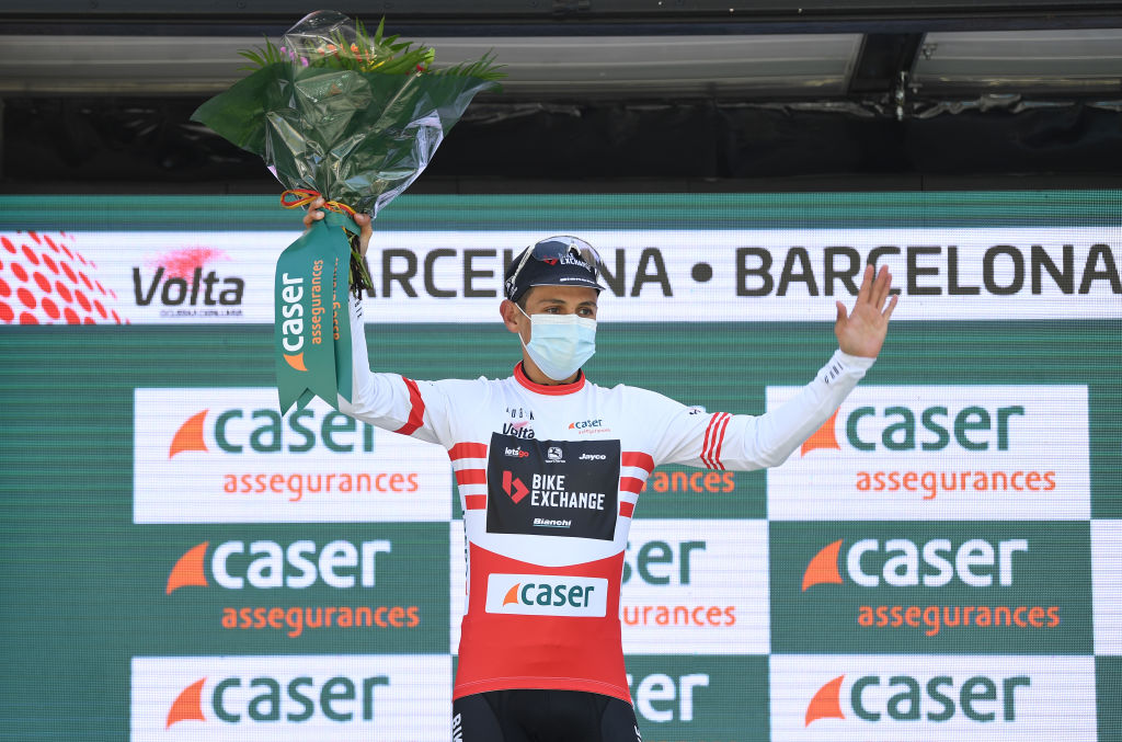 BARCELONA SPAIN  MARCH 28 Podium  Johan Esteban Chaves Rubio of Colombia and Team BikeExchange Red Mountain Jersey Celebration during the 100th Volta Ciclista a Catalunya 2021 Stage 7 a 133km stage from Barcelona to Barcelona  Mask  Covid safety measures  Flowers  VoltaCatalunya100  on March 28 2021 in Barcelona Spain Photo by David RamosGetty Images