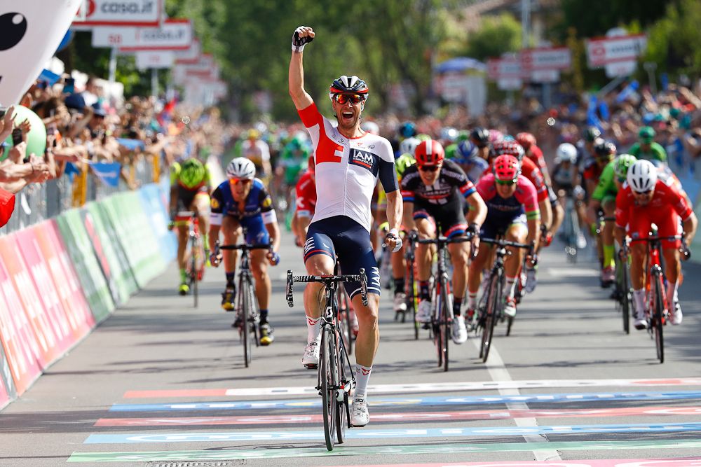 Roger Kluge celebrates as he crosses the finish line to win the 17th stage of the 99th Giro d'Italia