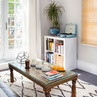 living room with white wooden shelf and dining table