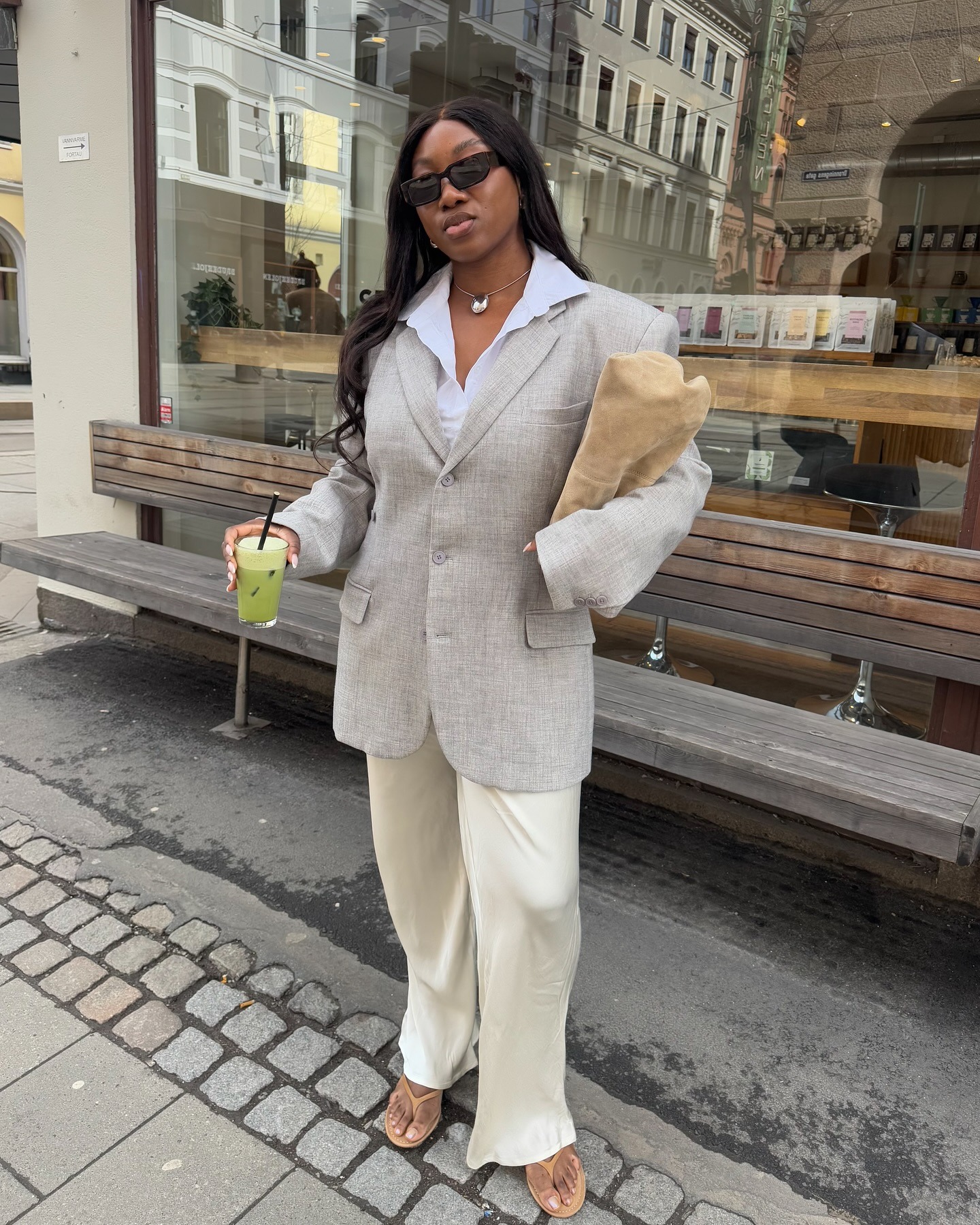 @nnennaechem in a relaxed trousers and flip flops outfit for spring 2026