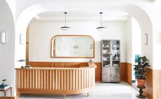 Hotel with minimalist lines, natural textures, warm wood surfaces, and plenty of californian sunlight