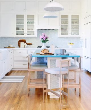 kitchen island color ideas, white kitchen, light and airy, grey hex tile backsplash, island with blue slab top, stools