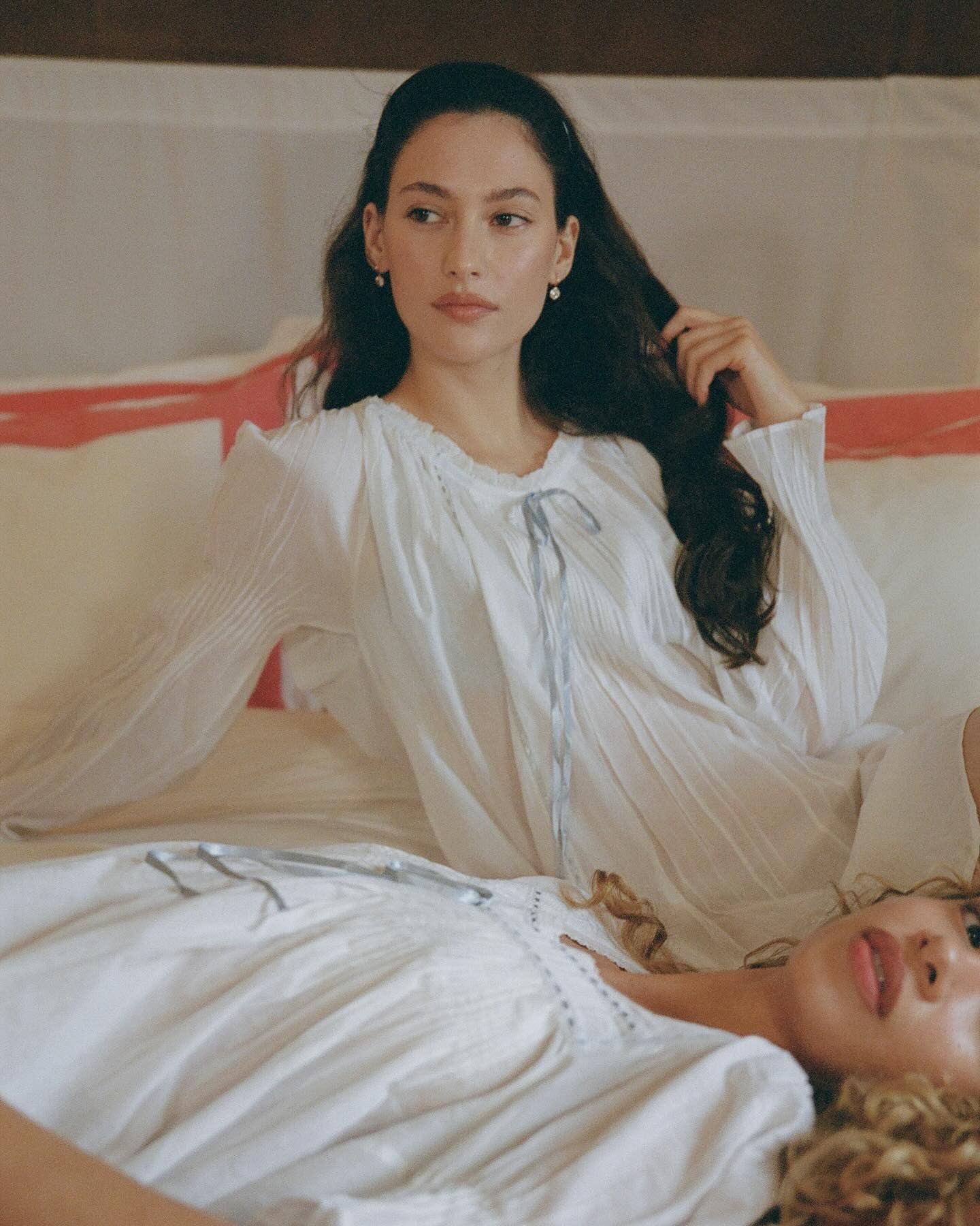 Influencer wearing white nightgown dress.