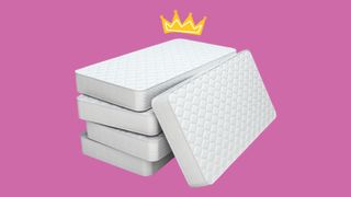 Mattress stack with crown on top pink background