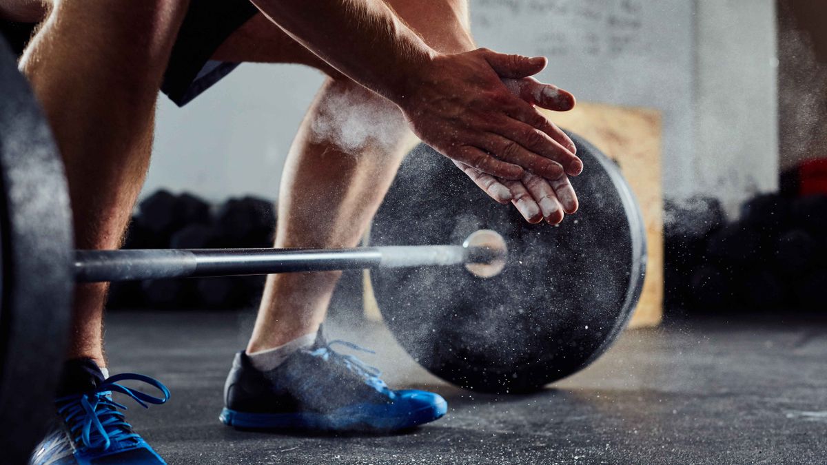 Man about to lift weights