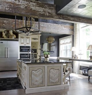 french style kitchens with ornate cooker hood and cabinetry