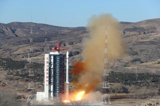 A Long March 4C rocket lifts off from Taiyuan carrying the Ziyuan-1 (02E) remote sensing satellite and a small passenger payload on Dec. 25, 2021