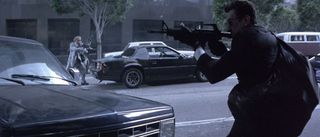 Chris Shiherlis (Val Kilmer in the distance) and Neil McCauley (Robert DeNiro in the foreground) battle with L.A.P.D. in