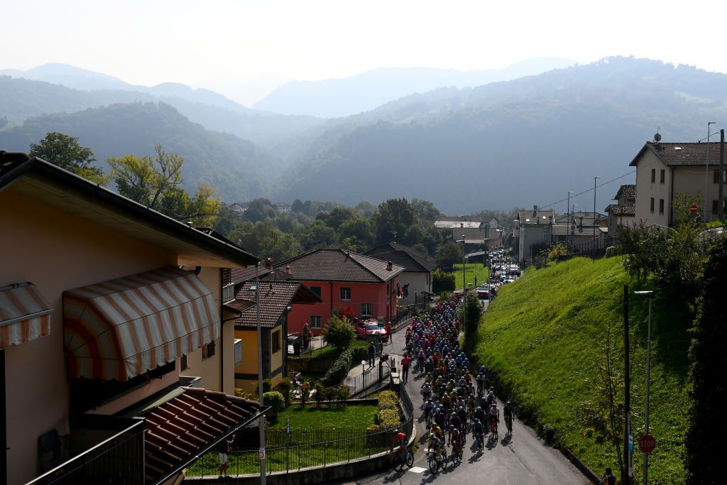 COMO ITALY OCTOBER 08 A general view of the Peloton compete climbing to the Ganda 1059m during the 116th Il Lombardia 2022 a 253km one day race from Bergamo to Como iLombardia on October 08 2022 in Como Italy Photo by Tim de WaeleGetty Images