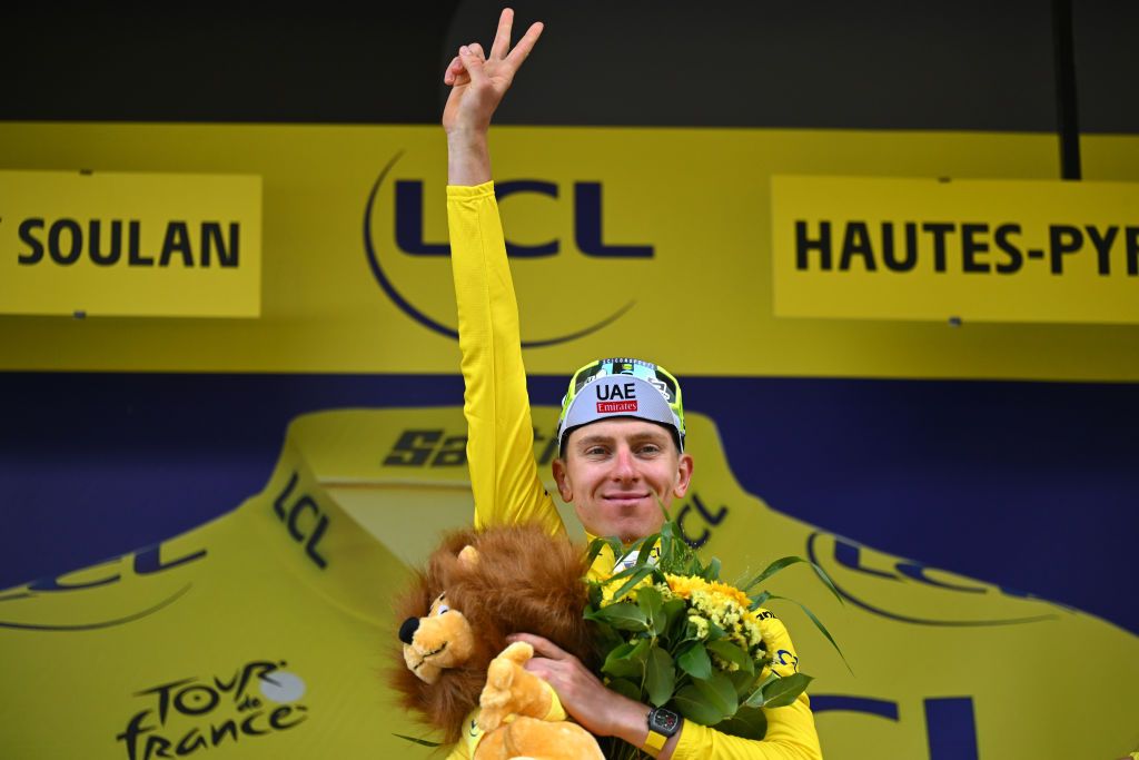 SAINTLARYSOULAN PLA DADET FRANCE JULY 13 Tadej Pogacar of Slovenia and UAE Team Emirates celebrates at podium as Yellow Leader Jersey winner during the 111th Tour de France 2024 Stage 14 a 1519km stage from Pau to SaintLarySoulan Pla dAdet 1653m UCIWT on July 13 2024 in SaintLarySoulan Pla dAdet France Photo by Tim de WaeleGetty Images
