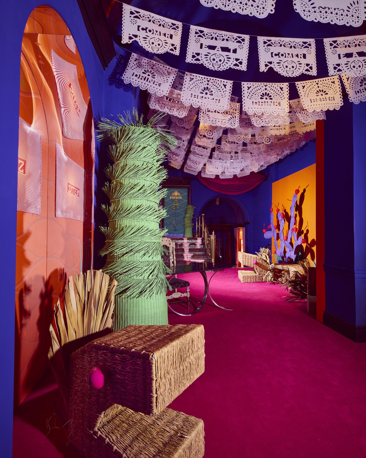 Installation view of &iexcl;hola, London!, a whimsical art installation made of whicker-made furniture molded after dragons, cacti, and fantastical creatures, at sketch London.