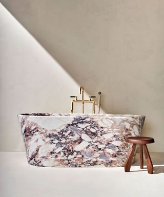 pink veined marble bath tub