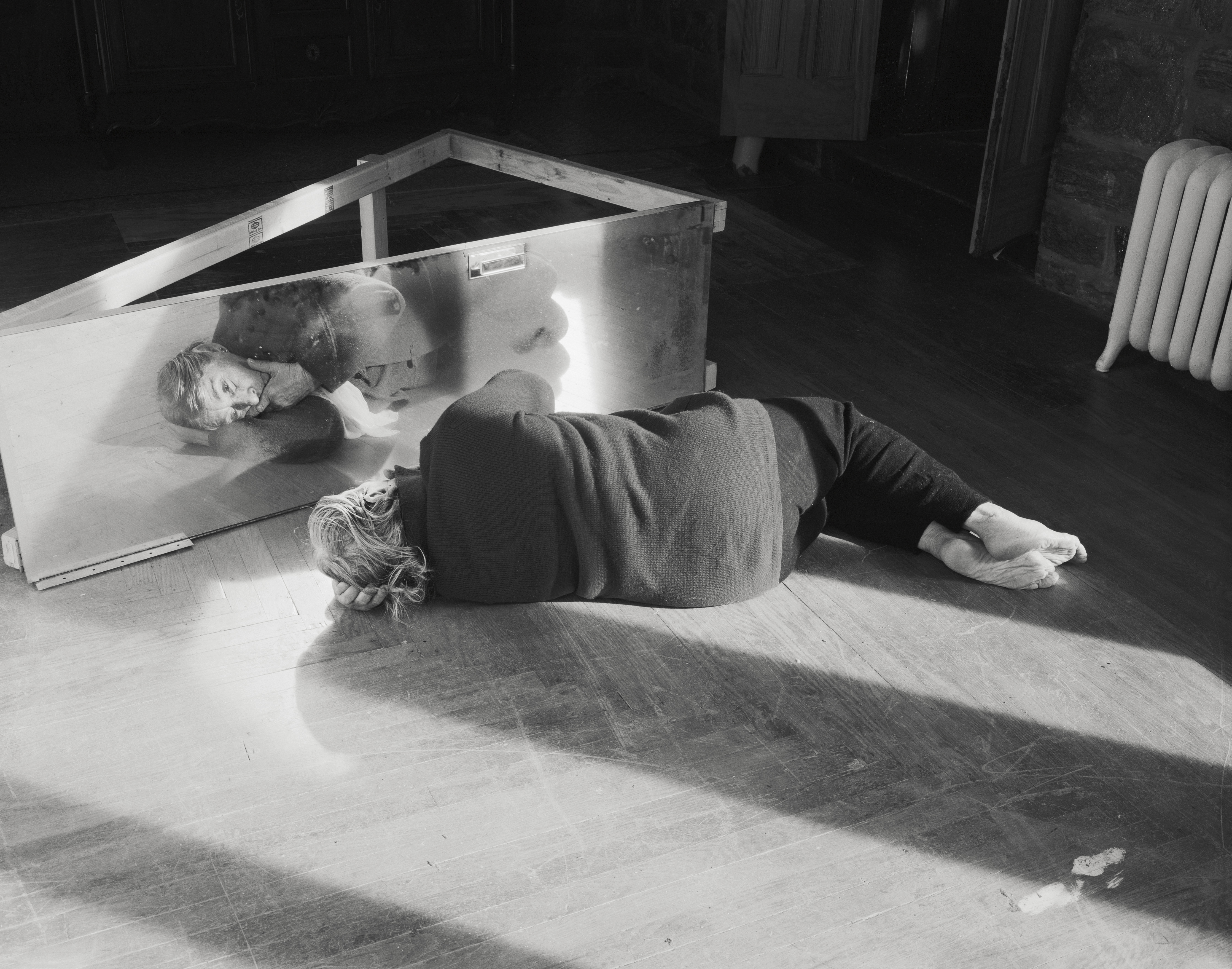 black and white images of an elderly woman in her house