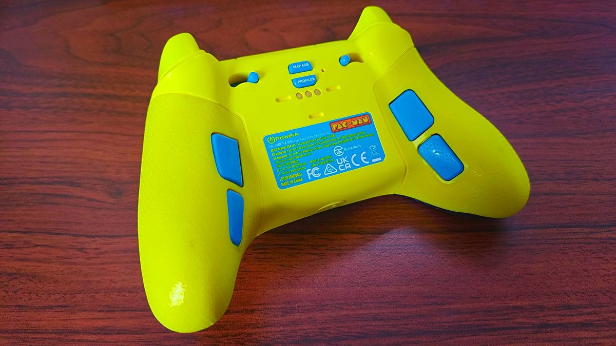 Back view of PowerA Pac-Man controller on woodgrain desk.