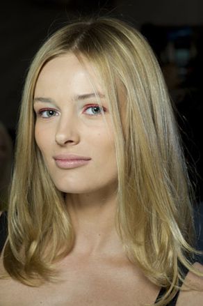 Blue eyed blonde model wearing light make-up