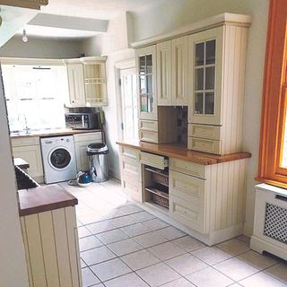 before kitchen renovation image of old white dark kitchen space