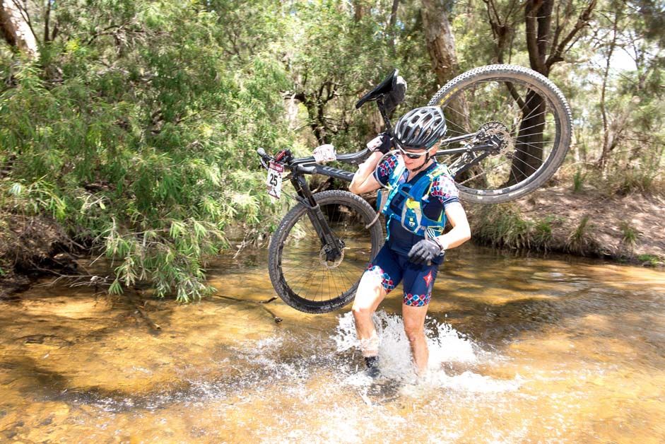 Ruth Corset makes her way through a river crossing
