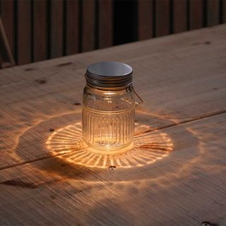 Clear lidded jar with orange light inside