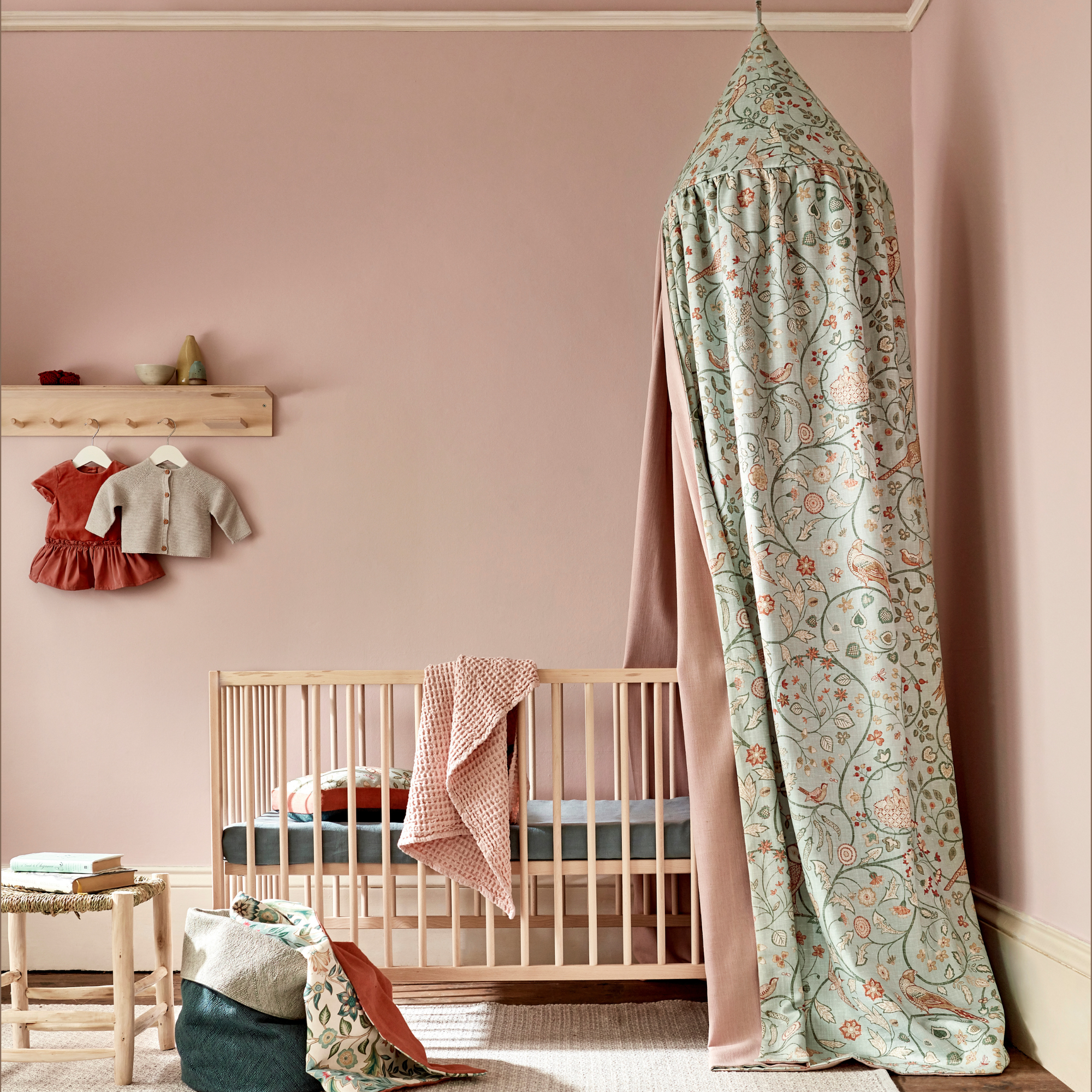 a nursery with morris & co newill fabric as canopy over cot