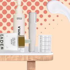 table with dark spot treatments on it on an orange polka dot background