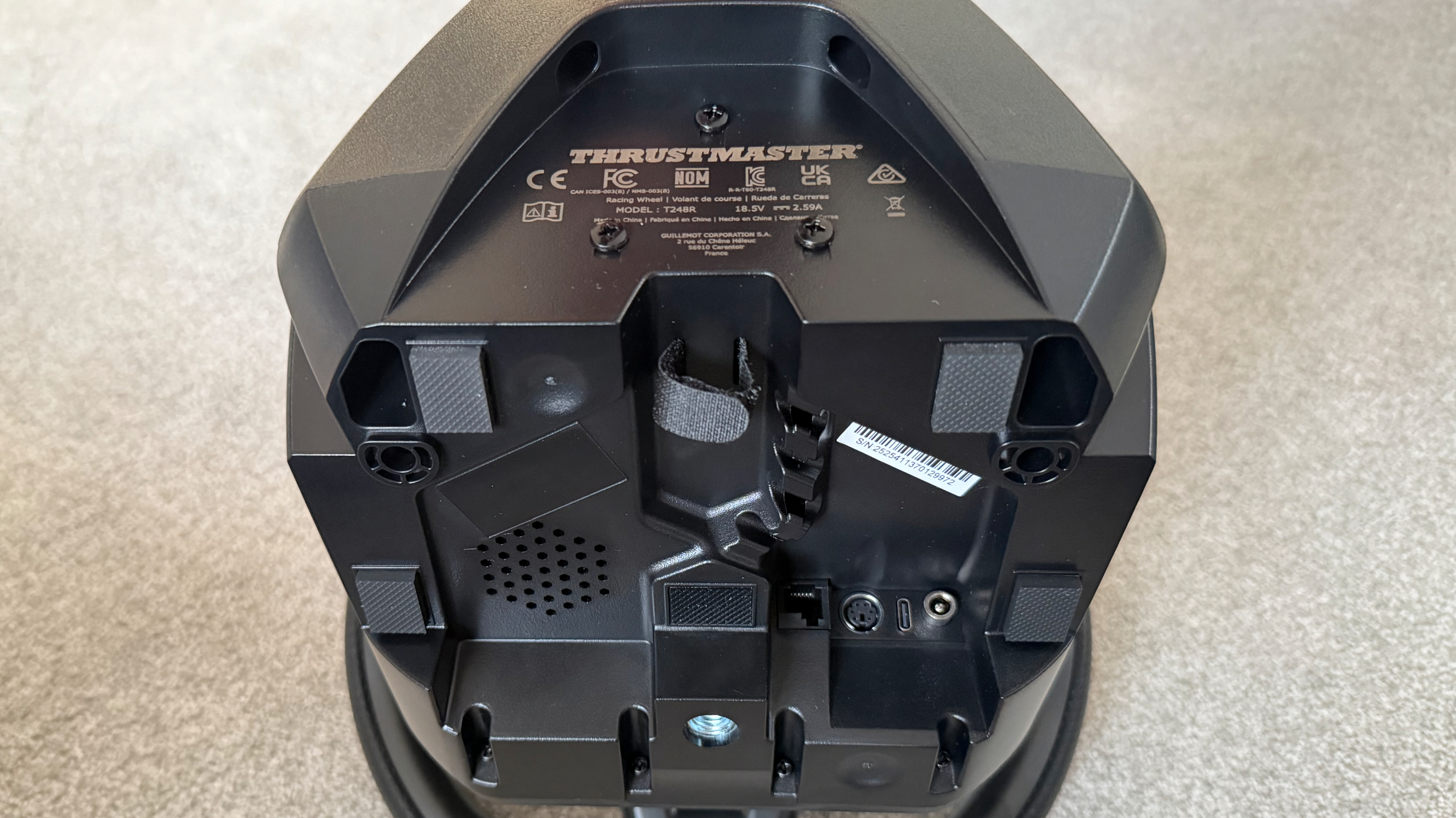 The bottom of the Thrustmaster T248R's wheelbase