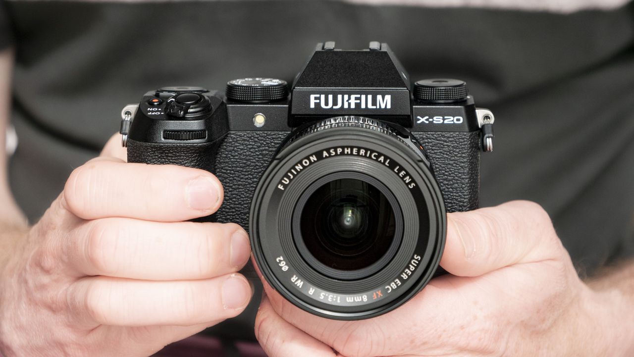 Fujifilm X-S20 camera in hand