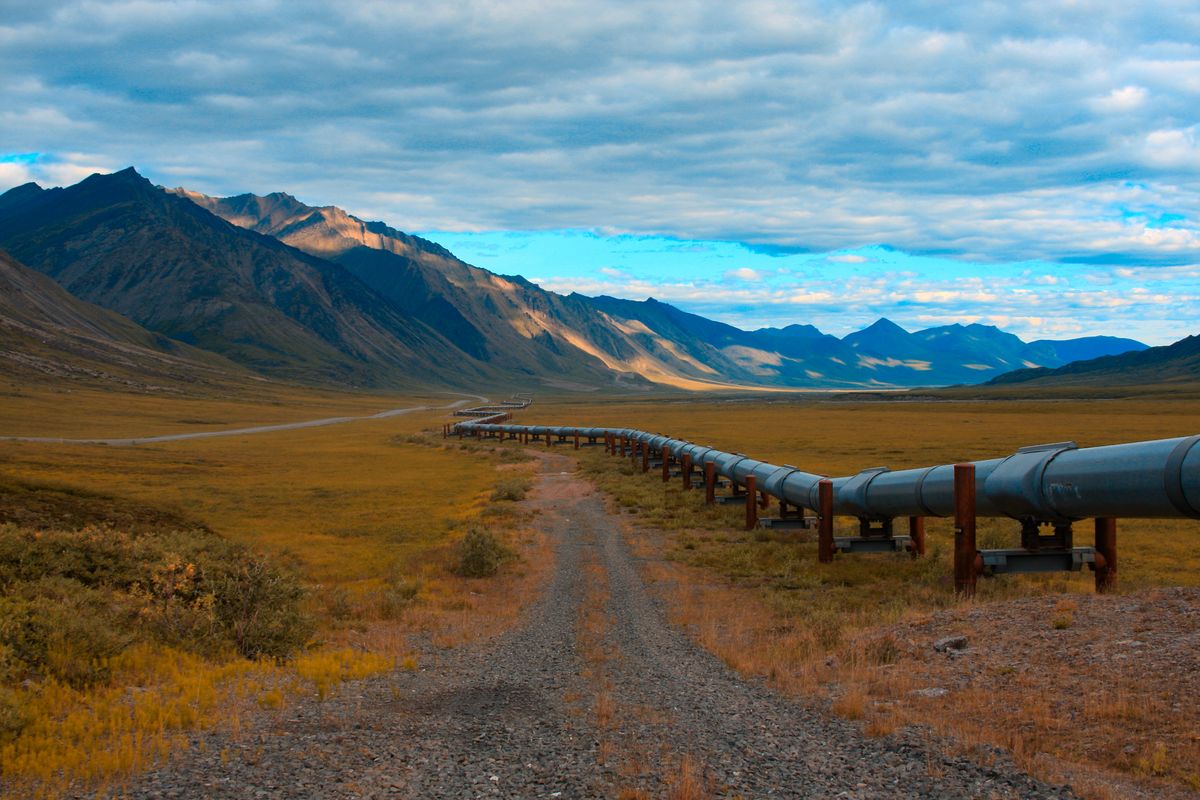 Long pipeline heading toward a mountain range