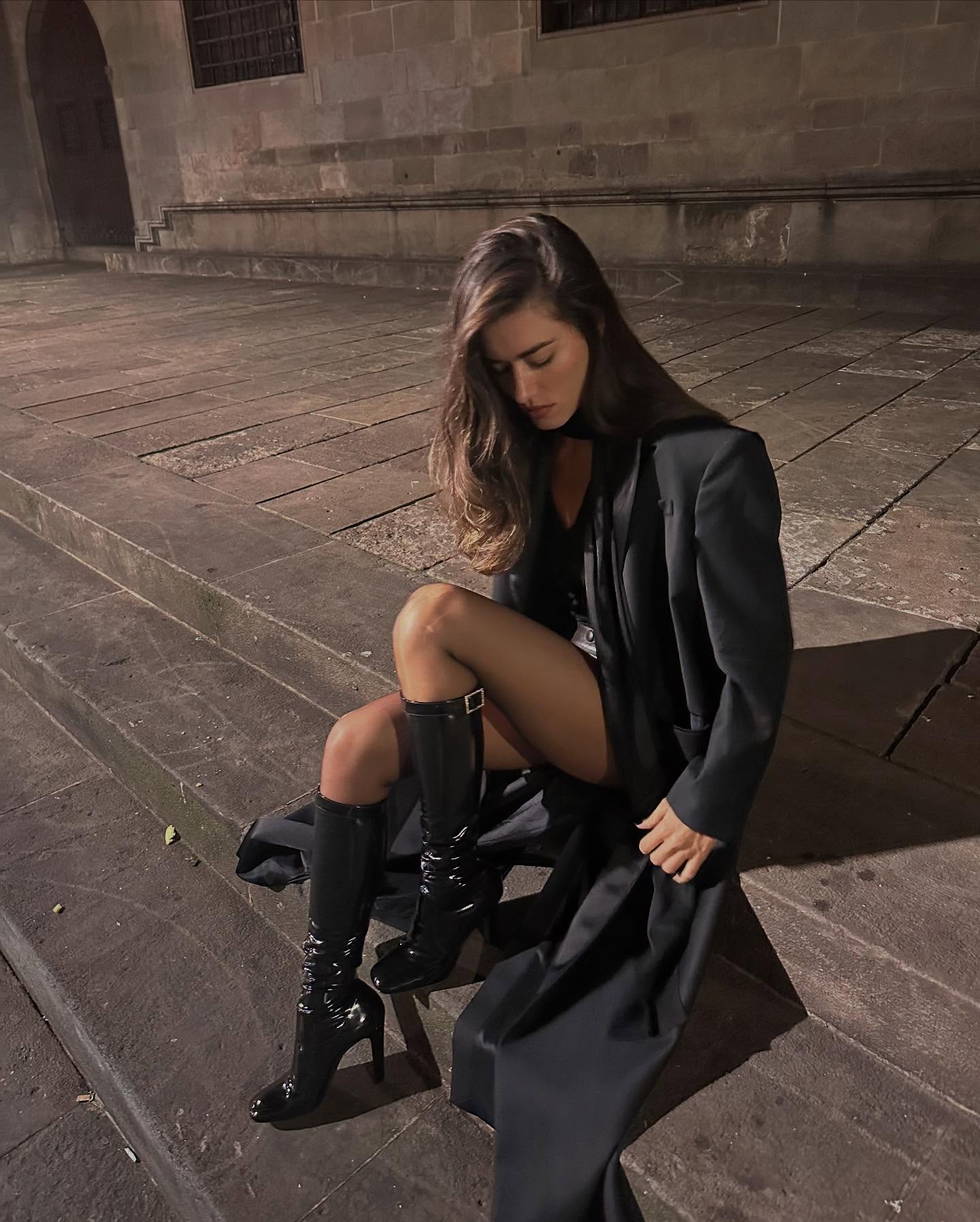 woman wearing knee high fitted boots