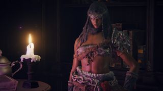 Elden Ring - Nepheli stands in Round Table Hold in front of a bookcase and a candle in her fur armor and head scarf