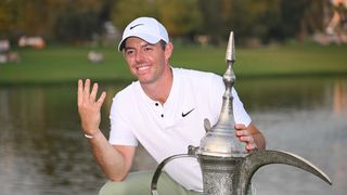 Rory McIlroy holds up four fingers to signify how many Dubai Desert Classic titles he has won