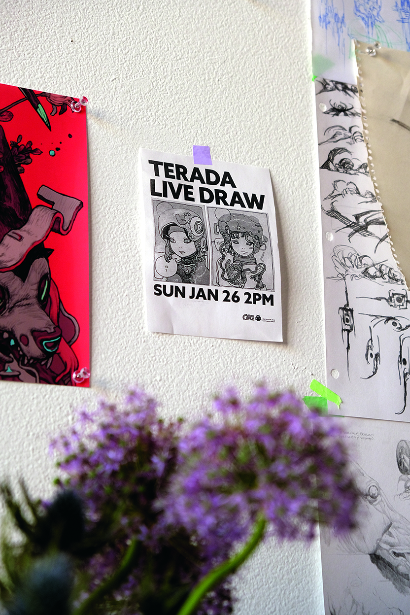 flyer for an art event on a wall