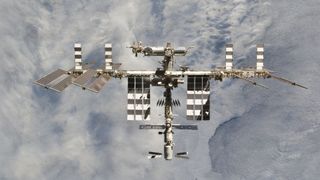 the international space station as photographed while looking down at Earth