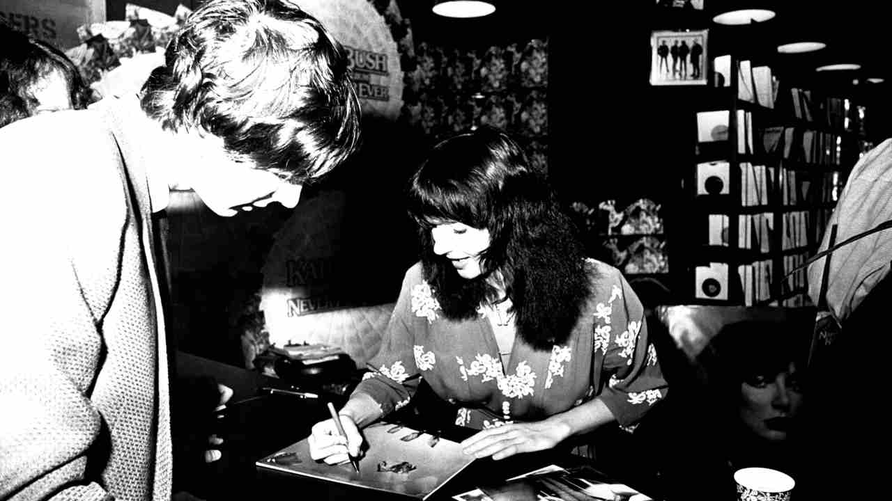 Kate Bush signing autographs in a record store in 1980