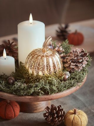 autumnal fall table display with pumpkins and candles