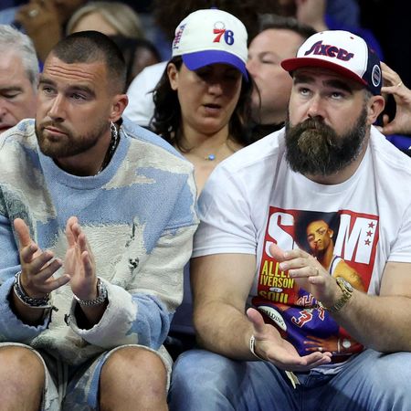 Travis and Jason Kelce watch the Boston Celtics v Philadelphia 76ers game