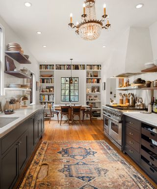 Chef’s kitchen and dining table in Walton Goggins’ house which is for sale in Hollywood, Los Angeles