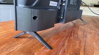 TCL 32SF540K 32-inch TV on wooden table showing rear connections