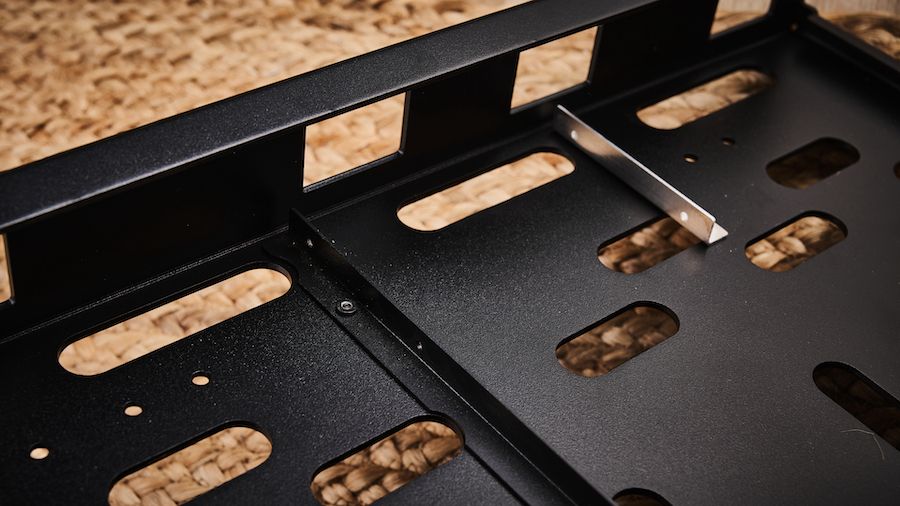The power supply mounting bracket on the underside of the Voodoo Labs Dingbat Medium