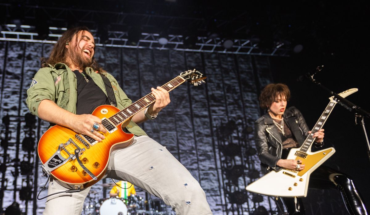 Joe Hottinger (left) and Lzzy Hale of Halestorm perform on stage at The SSE Hydro on November 24, 2019 in Glasgow, Scotland