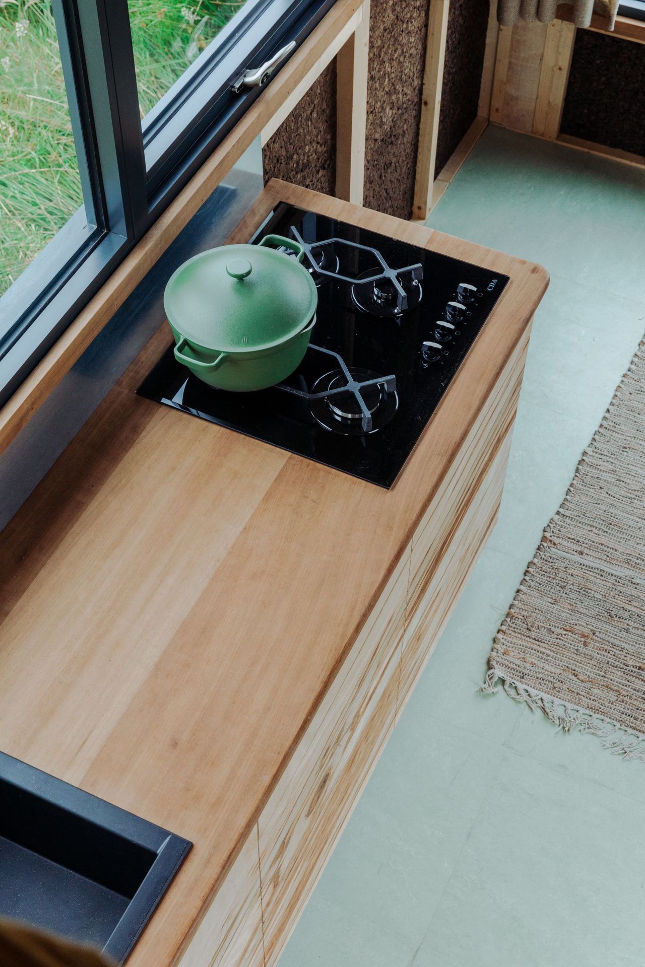 The wooden kitchen worktop inside the tiny eco home