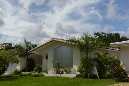 Hurricane shutters on a home in south Miami