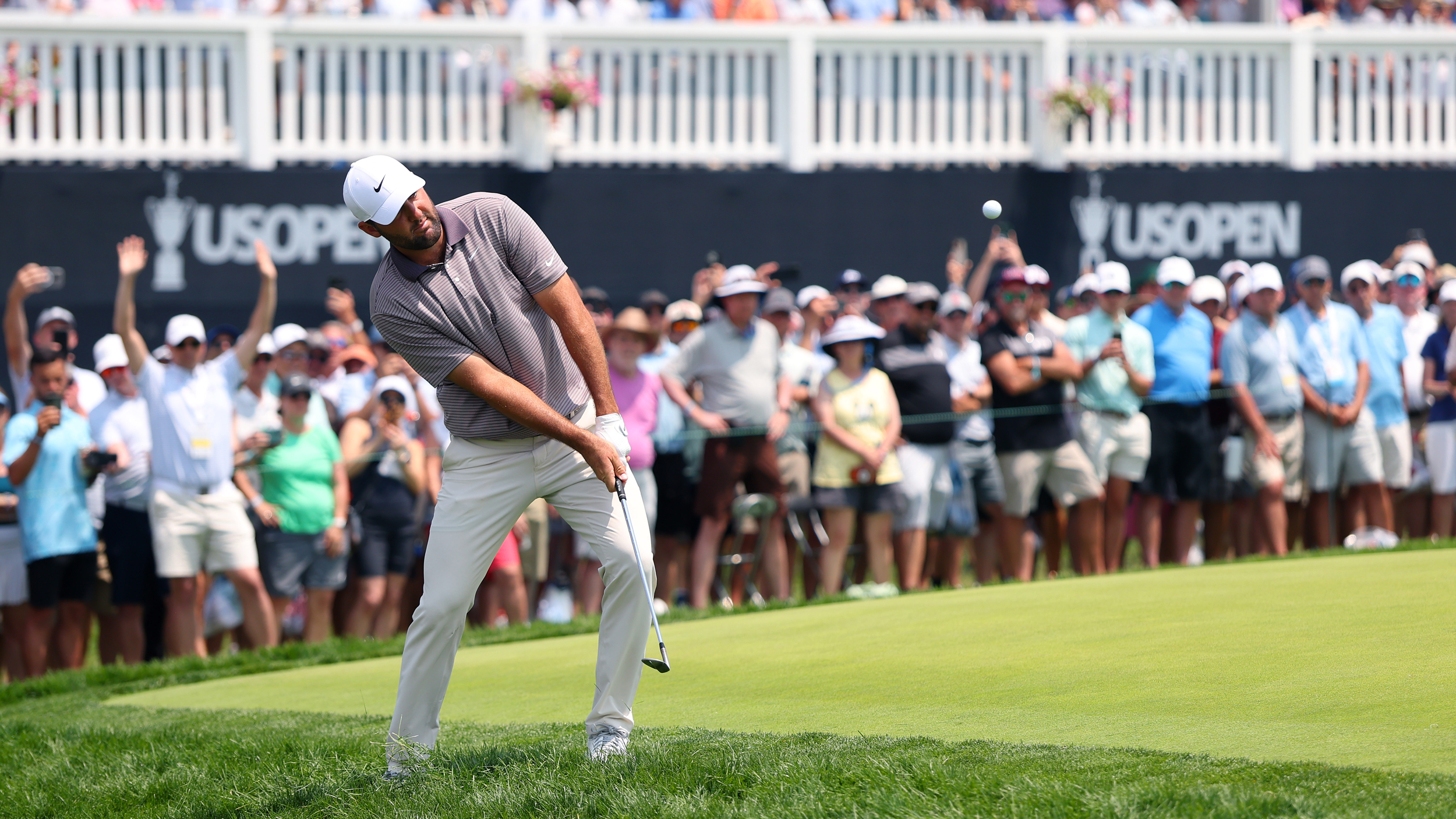 Scottie Scheffler hits a chip shot at the US Open
