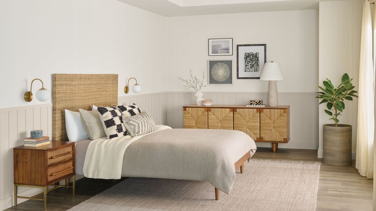 neutral bedroom with light wooden double bed and sideboard