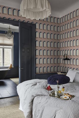 Bedroom with contemporary wallpaper in pink by Sandberg